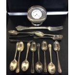 A COLLECTION OF EARLY 20TH CENTURY SILVER ITEMS To include an Art Deco style travelling clock, a