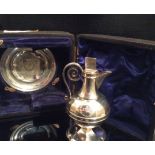 WALKER & HALL, A VICTORIAN SILVER ECCLESIASTICAL PART COMMUNION SET To include a wine/water ewer,