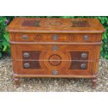 A CONTINENTAL WALNUT AND PROFUSELY MARQUETRY INLAID COMMODE CHEST Of three drawers.