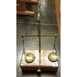 AN EARLY VICTORIAN TABLE TOP SET OF MAHOGANY AND BRASS WEIGHING SCALES With weights and lower