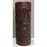 A CHINESE BAMBOO BRUSH POT Deeply carved with elders, viewing scrolls and playing games, in an