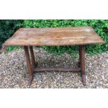 GORDON RUSSELL, A RARE AND EARLY SOLID ELM TRESTLE TABLE