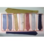 HERMÈS, A COLLECTION OF NINE SILK DRESS TIES Seven in original boxes, featuring designs such as