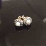 A PAIR OF VINTAGE 14CT GOLD, PEARL AND DIAMOND CLUSTER EAR STUDS Small pearls (untested), each peg