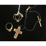 A 15CT GOLD CRUCIFIX Along with three 9ct gold rings