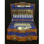 AN EXTENSIVE ART DECO PERIOD OAK CASED CANTEEN OF CUTLERY With silver plated spoons and forks.