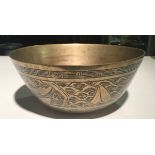 A HEAVY ANTIQUE CHINESE BRONZE BOWL With chased and engraved decoration, in the form of mythical
