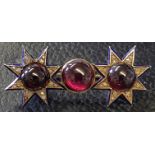 A VICTORIAN 14K GOLD, ENAMEL, DIAMOND AND GARNET BROOCH In the form of a two stars.