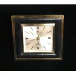 CARTIER, CYMA, A GILT METAL AND LEATHER STRUT TABLE CLOCK. 5851/BG10016888/1