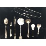 A COLLECTION OF VARIOUS SILVER ITEMS To include caddy spoons, pickle forks, tongs.