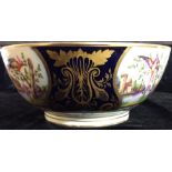 A 19TH CENTURY CONTINENTAL PORCELAIN BOWL With four hand painted cartouches, depicting exotic