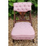 IN THE MANNER OF CHRISTOPHER DRESSER, A VICTORIAN WALNUT BUTTON BACK UPHOLSTERED BEDROOM CHAIR.