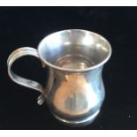 AN ENGLISH HALLMARKED SILVER CUP With scroll handle.