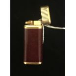 CARTIER, PARIS, A LADIES' GOLD PLATED AND ROUGE STONE LIGHTER. 5851/BG10016754/1