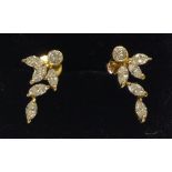 A PAIR OF 18CT GOLD AND DIAMOND STUD EARRINGS In the form of leaves, stamped '750' on earrings and