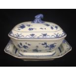 A 19TH CENTURY CHINESE EXPORT WARE BLUE AND WHITE SOUP TUREEN AND COVER Raised on stand.