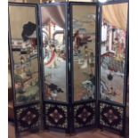 A 20TH CENTURY ORIENTAL BLACK LACQUER SCREEN With four sections, Oriental ladies enjoying a ceremony