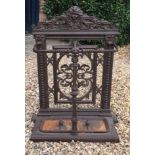 A 19TH CENTURY CAST IRON COALBROOKDALE DESIGN DOUBLE STICK STAND Decorated with a cherub mask