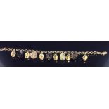 MILOR, A 9CT GOLD AND QUARTZ CHARM BRACELET Cable link chain with six gold pod-shaped charms,