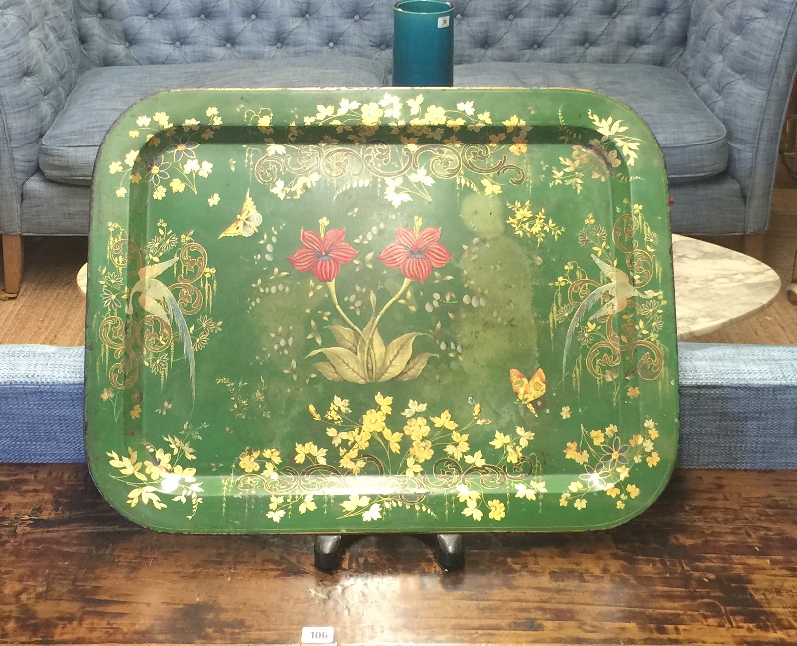 A LATE 19TH/EARLY 20TH CENTURY TOLEWARE DECORATED METAL TRAY With flowers and insects on a green