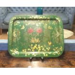 A LATE 19TH/EARLY 20TH CENTURY TOLEWARE DECORATED METAL TRAY With flowers and insects on a green