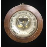 A LATE VICTORIAN/EDWARDIAN CIRCULAR HOLOSTERIC BAROMETER. (d 26cm)