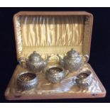 WOOD & HUGHES, A 19TH CENTURY AMERICAN STERLING SILVER FIVE PIECE TEA SERVICE To include two