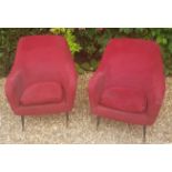 A PAIR OF 1960'S ITALIAN TUB ARMCHAIRS In red fabric upholstery, raised on turned tapering legs.