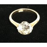 AN 18CT GOLD AND OLD CUT DIAMOND SOLITAIRE RING The diamond in a later 14ct white gold claw