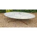 A VINTAGE 1960'S OVAL COFFEE TABLE The veined white marble top raised on a single brass column, with