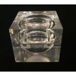 A DESIGNER THICK FORM LUCITE ICE BUCKET With sphere shaped void and swivel top.