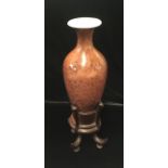 A CHINESE BUD VASE Tapering body bearing kangxi six character mark on hardwood stand.