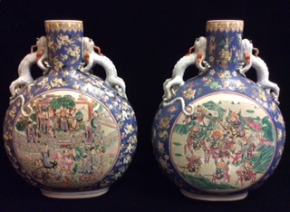 A LARGE PAIR OF CHINESE FAMILLE ROSE PORCELAIN MOON FLASKS With blue grounds and central circular