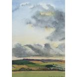 PAT SHARP, 1982, WATERCOLOUR Landscape with a cloudy sky, framed and glazed. (18cm x 25cm not