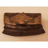 A 18TH/19TH CENTURY SINO-TIBETAN 'CHUCKMUCK' WITH TWO FLINTS The leather pouch, with integral