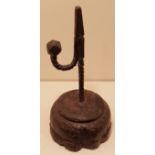 A 17TH/18TH CENTURY IRON TABLE RUSHLIGHT The stem and 'U' form arm, with deep spiral and multi