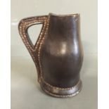 A 17TH/18TH CENTURY LEATHER BLACK JACK JUG The body with bulbous lower stitched integral handle