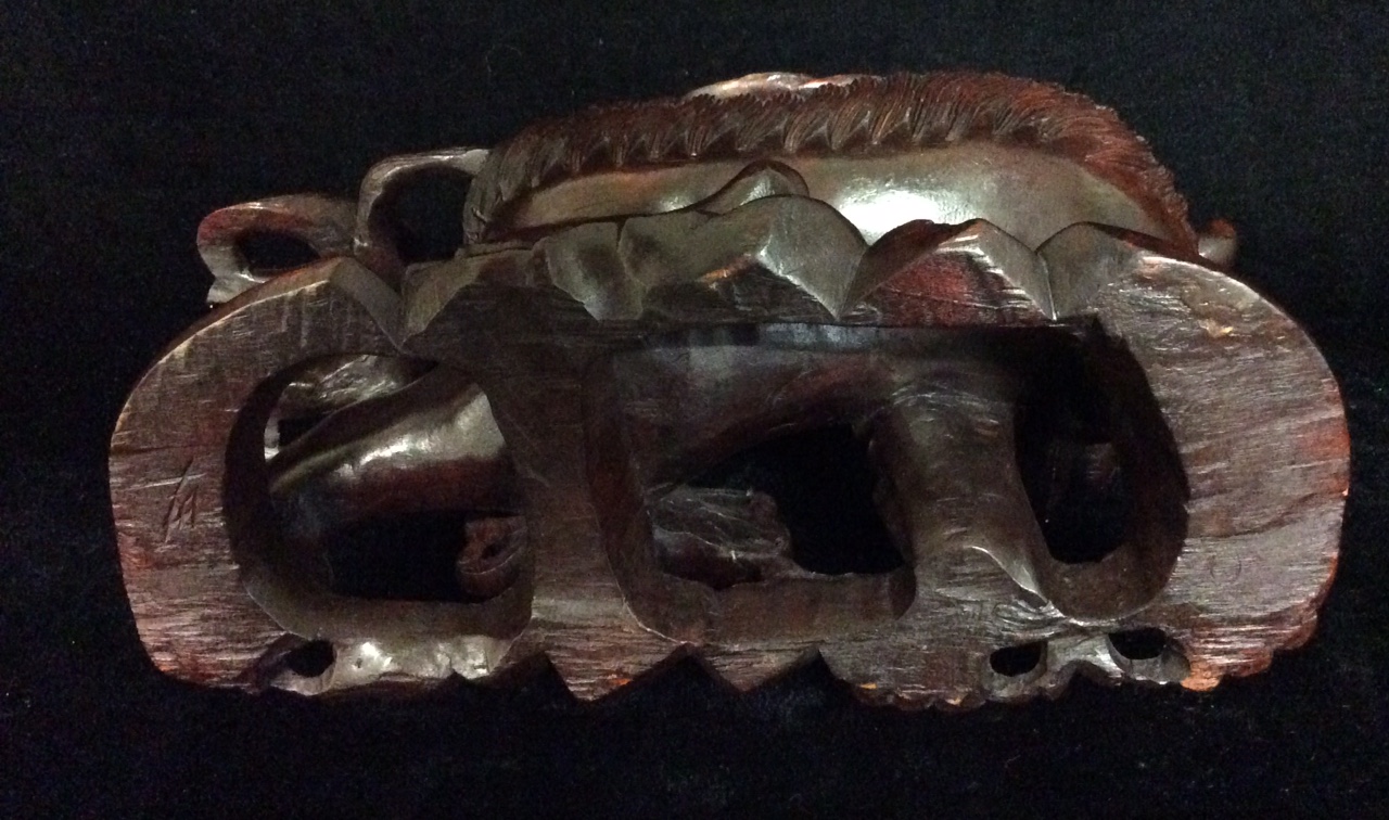 A 19TH CENTURY ORIENTAL HARDWOOD FIGURAL CARVING OF FO DOGS At play, a large dog with finely - Image 2 of 3
