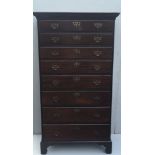 AN EARLY 19TH CENTURY MAHOGANY TALLBOY CHEST Of eight long drawers, applied with pierced brass plate