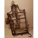 AN 18TH CENTURY STEEL AND IRON COUNTERWEIGHT SPIT JACK Clockwork mechanism, with ropes and