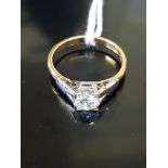 AN 18CT GOLD AND DIAMOND SOLITAIRE RING Having a single round cut stone, set in a white gold mount