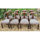 A SET OF EIGHT VICTORIAN MAHOGANY DINING CHAIRS The hoop backs centred with a pierced vase splat,