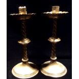 A PAIR OF 19 TH CENTURY ECCLESIASTICAL BRASS CANDLESTICKS Scalloped edged sconces and April twist