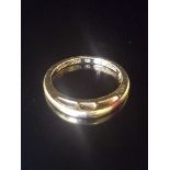 CARTIER, AN 18CT GOLD RING The plain gold band raised to front on a pierced gallery, signed '