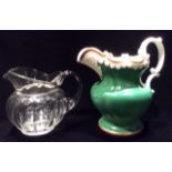 AN EARLY 19TH CENTURY ENGLISH POTTERY JUG Scalloped edge with gilt accents and green ground body,