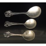 JOHANNES SIGGAARD, 1890 - 1964, TWO DANISH SILVER SERVING SPOONS With pierced decoration to handle