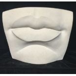 A LARGE CARVED STONE SCULPTURE Lips, unsigned. (60cm x 50cm) (60k)