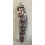 AN 18TH CENTURY LEATHER BOTTLE Moulded in the form of a Dagg pistol, the polished body with