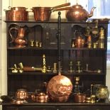 A LARGE QUANTITY OF COPPER AND BRASS ITEMS To include a copper bed pan, brass candlesticks, a