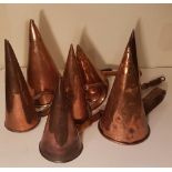 SEVEN 19TH CENTURY COPPER CONICAL ALE/BEER WARMERS. (largest 27cm)